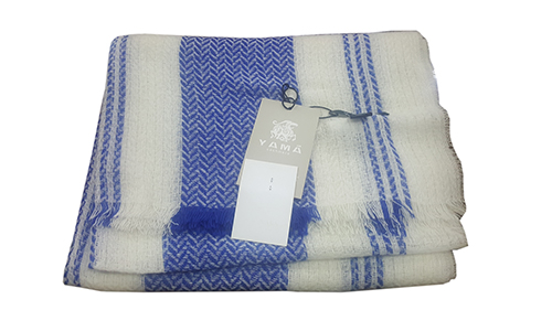 Lightweight fine-gauge woven fabric shawl.