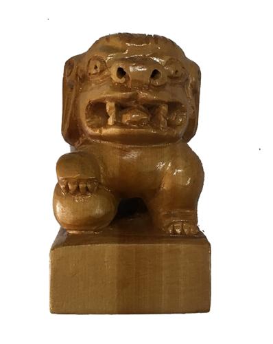 Handmade wooden carving of lion.
